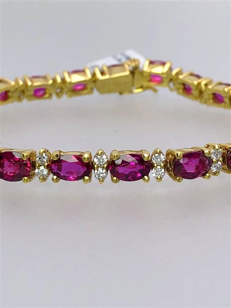 Cellini 18kt Yellow Gold 11 36 Carat Oval Ruby And 1 10 Carat Diamond