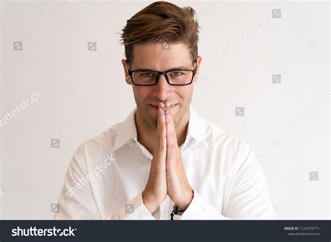 Smiling Young Man Keeping Hands Together Stock Photo Edit Now 1124576771