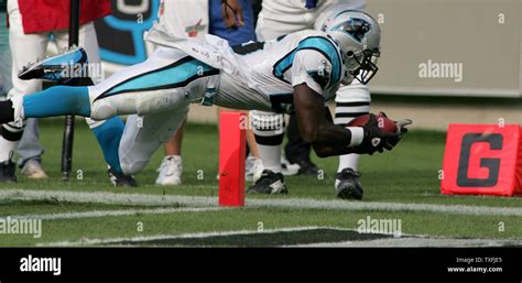 Carolina Panthers Running Back Deshaun Foster Dives Into The End Zone