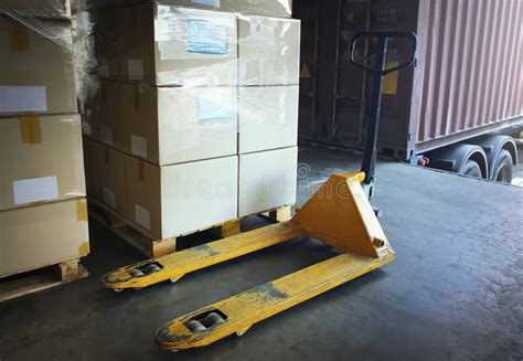 Hand Pallet Truck With Packaging Boxes Stacked On Pallets Hand Lift