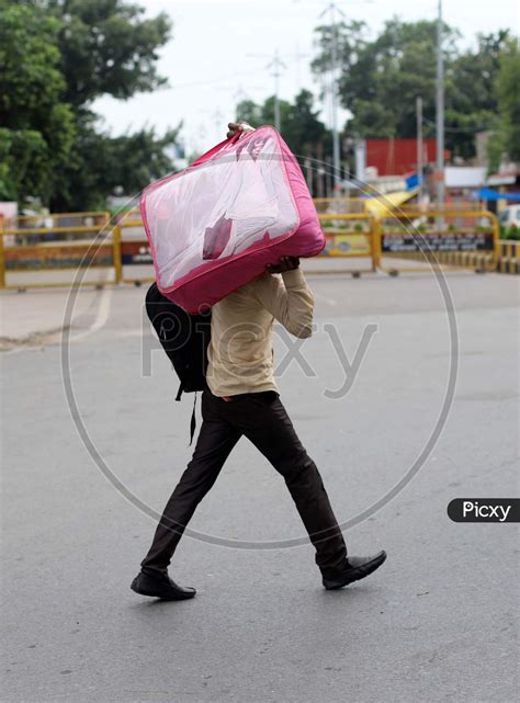 Image Of A Man Walks On The Empty Road During Total Lockdown Imposed By