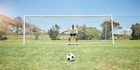 Premium Photo | Goalkeeper soccer field and sports man ready in penalty ...