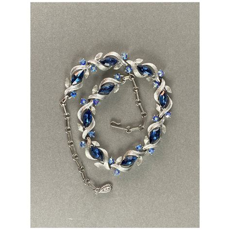 Deep Blue Navettes Wrapped In Silvertone Branch Leaves With AB