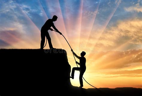 Silhouette Of A Man Helping Another Man Climb Up Stock Image Image Of People Teamwork 116865641