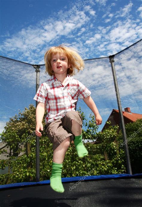 Child jumping trampoline — Stock Photo © tlorna #5464569