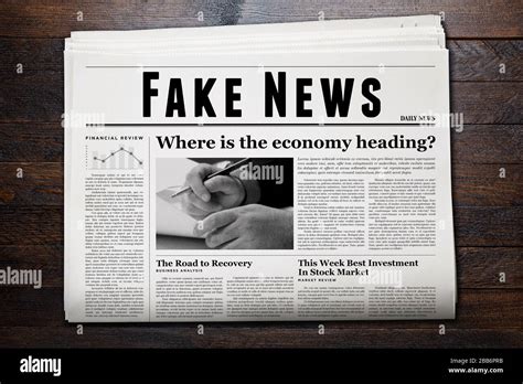 A newspaper showing 'Fake News' as headline Stock Photo - Alamy