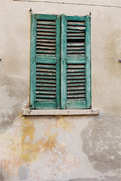 Broken Wooden Window Shutters Seen On Old Italian Building By Stocksy