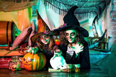 Premium Photo | Children friends wearing halloween costume with pumpkin ...