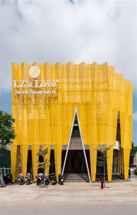 A Large Yellow Building With Scaffolding On It S Side And Motorcycles