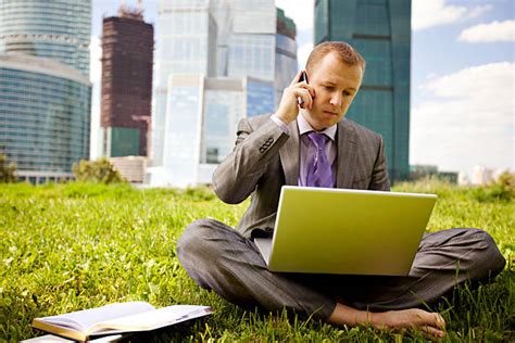 100 Businessman Relaxing In The Grass With His Shoes Off Stock Photos