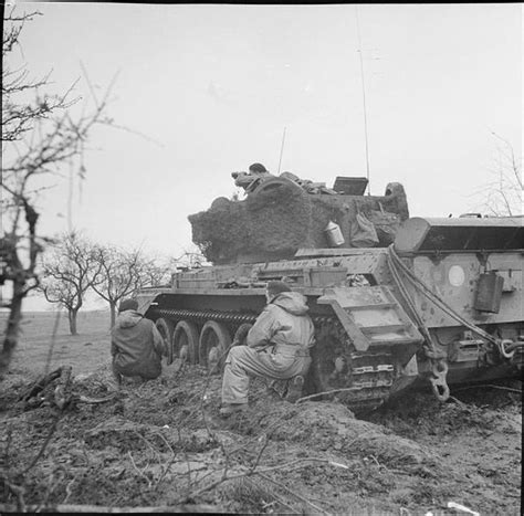 The crew of a Cromwell artillery observation post tank keep watch on the enemy, near Gangelt in ...