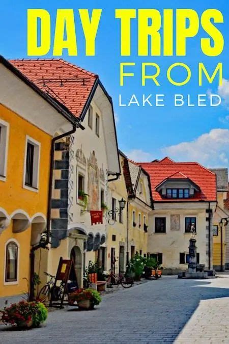 A Street Lined With Yellow Buildings And The Words Day Trips From Lake