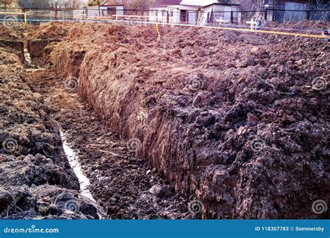 Trench Dug By Hand Under The Foundation Or For Laying Drainage A Stock