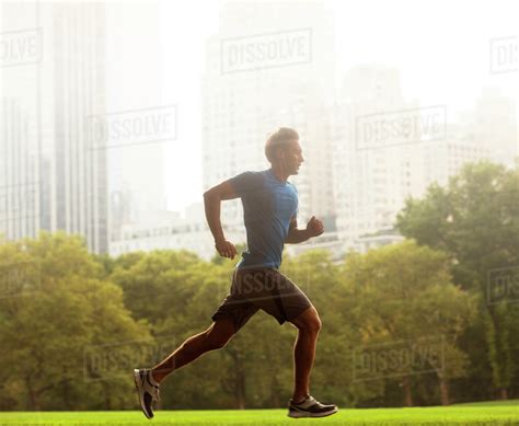 Man Running In Urban Park Stock Photo Dissolve