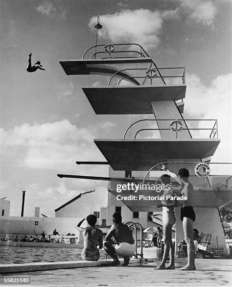 People Sit Poolside And Watch As A Swimmer Dives Off The High News