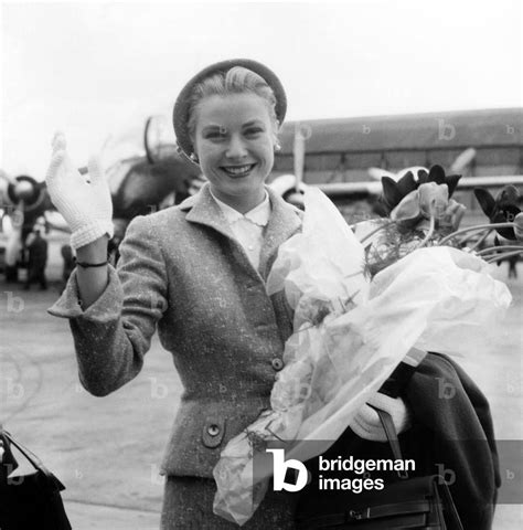 Actress Grace Kelly With Chanel Suit Holding Hermes Hand Bag At Orly