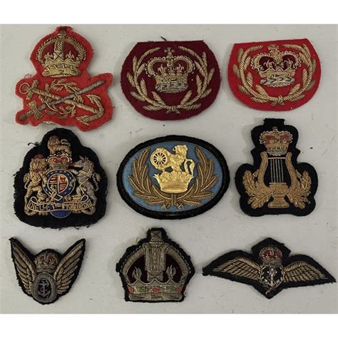 A Quantity Of Military And Naval Embroidered And Cloth Badges In