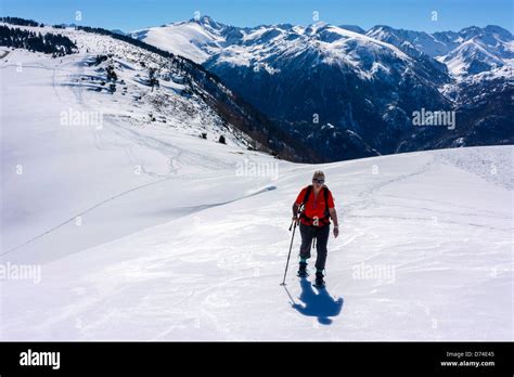 Female Figure In Red Snowshoeing Plateau De Beille Ariege French