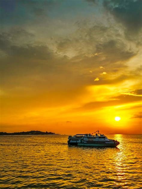 Photo Of White And Blue Boat On Body Of Water · Free Stock Photo