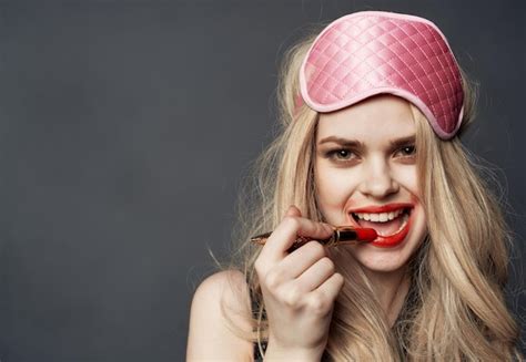 Premium Photo Drunk Blonde With Bright Makeup On Her Face Red Lips And A Pink Sleep Mask High