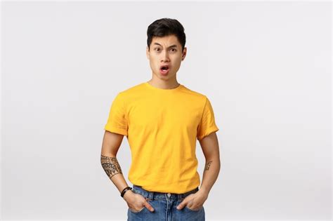 Premium Photo Shocked Cute Asian Man In Yellow T Shirt