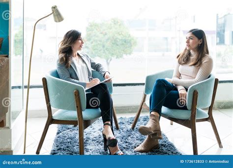 Woman Talking To Therapist At Office During Treatment Stock Image