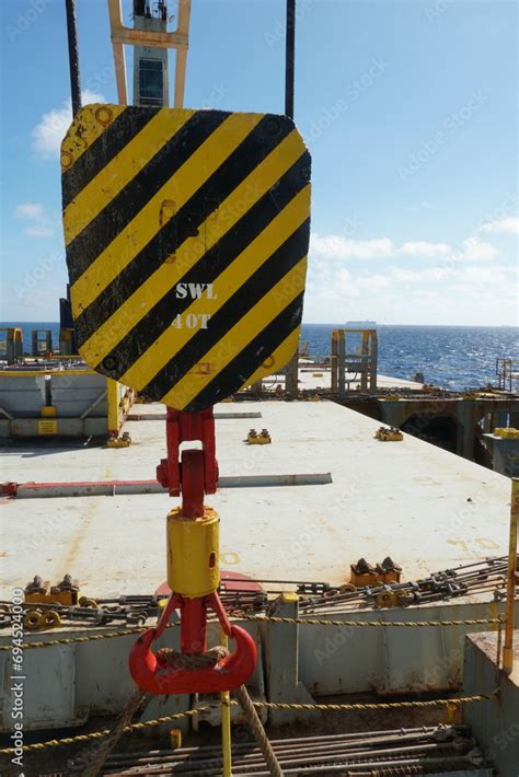 Plakat Red Steel Hook And Black And Yellow Hoist Block Of Ship S Cargo