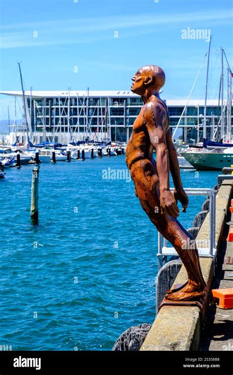 Solace in The Wind The Naked Man bronze statue by British artist Max Patté waterfront walk