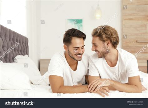 Happy Gay Couple Lying On Bed Stock Photo Shutterstock