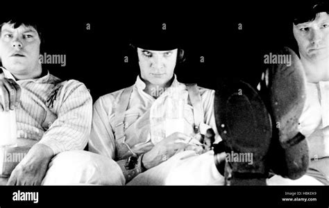 A CLOCKWORK ORANGE, from left, Warren Clarke, Malcolm McDowell, James Marcus, 1971 Stock Photo ...