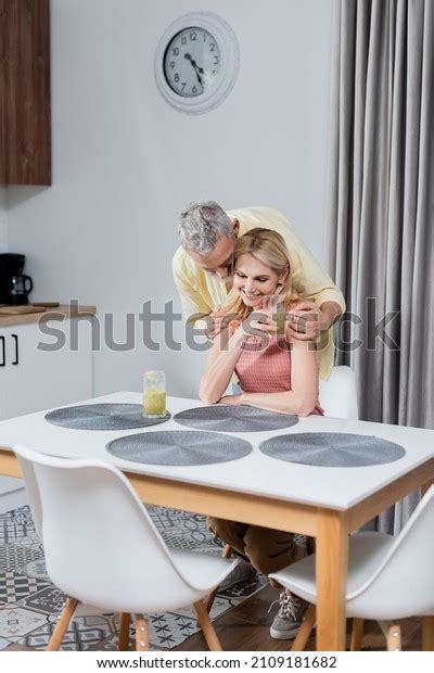 Mature Man Hugging Smiling Wife Glass Stock Photo Shutterstock
