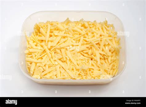 Grated cheddar cheese Stock Photo - Alamy