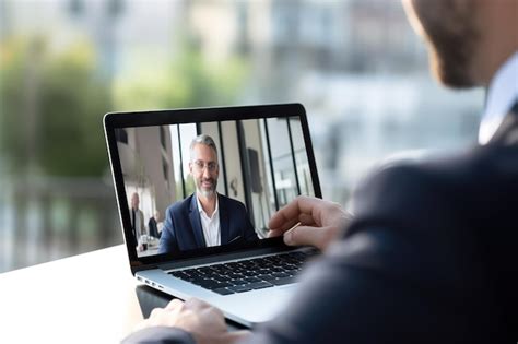 Premium Ai Image Online Conference Meeting On A Laptop Outdoors
