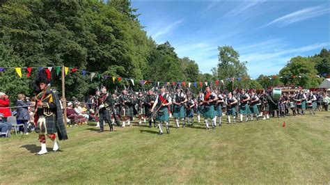 Massed Pipe Bands March On For Afternoon Parade During 2022 Drumtochty