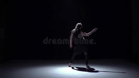 Modern Dancer Girl In Dark Dress Dancing Contemporary On Black Shadow