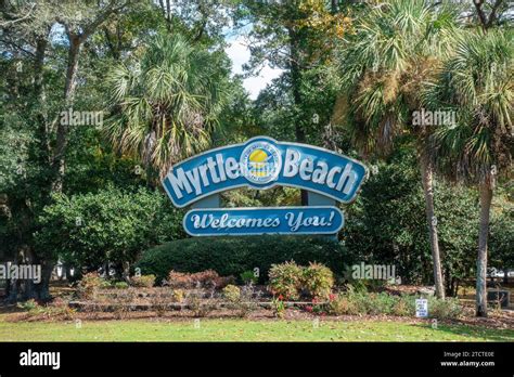 Myrtle Beach Welcome Sign With A Background Of Palm Trees City Of