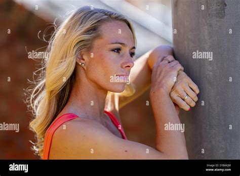 Radiant Blonde Athlete Shines At The Track On A Stunning Day Embodying Strength And Grace In