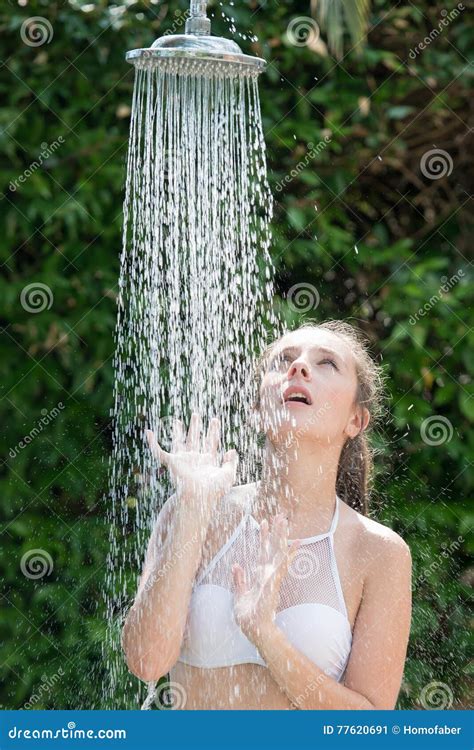 Girl Wear Bikini Standing Under The Outdoor Pool Shower Stock Image