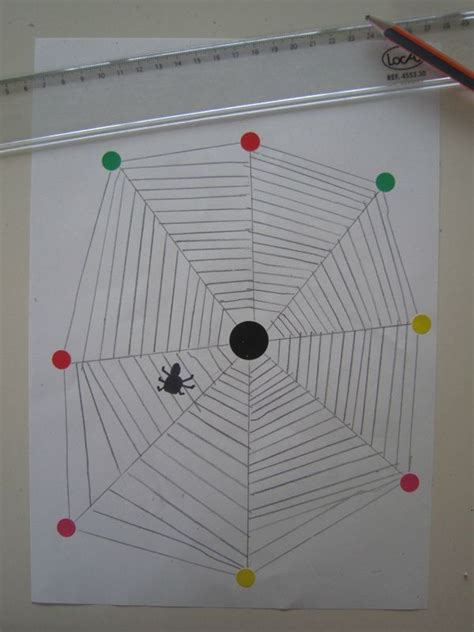 A Spider Web Is Drawn On Paper With Markers