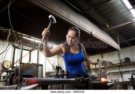 Female Metalsmith Hammering Red Hot Metal Rod On Workshop Anvil Stock Image Blacksmithing