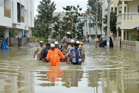 Heavy Rains Floods Throw Life Out Of Gear In Assam Bengaluru And