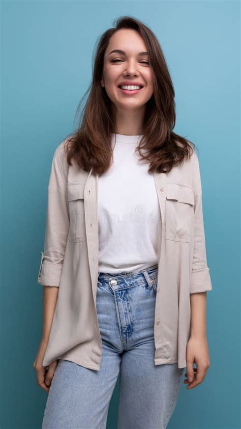 Smiling Lovely Brunette 30 Year Old Female Person In Shirt And Jeans Is Happy Stock Photo