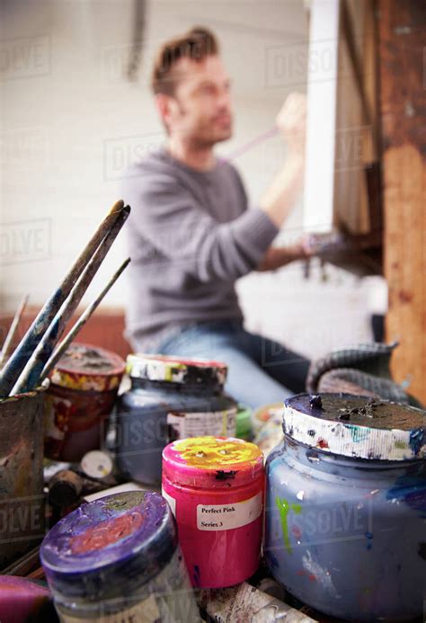 Male Artist Working On Painting In Studio Stock Photo Dissolve