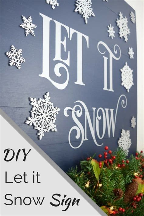 A Sign That Says Let It Snow On The Side Of A Wall With Christmas