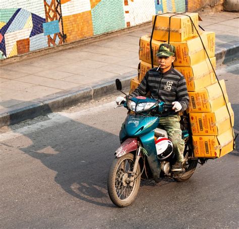 Vietnamese Driving a Motorbike and Transporting a Lot of Packages ...