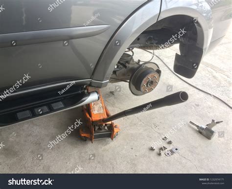 Car Remove Wheel Maintenance Body Lift Stock Photo 1232974171