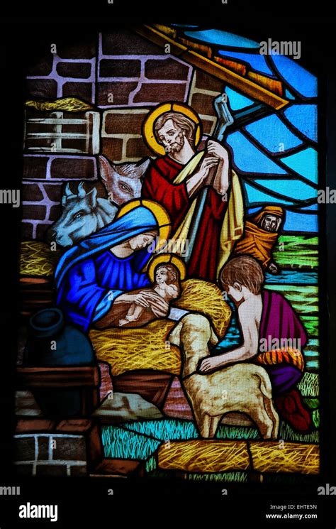 Stained Glass Window Depicting A Nativity Scene And The Adoration Of