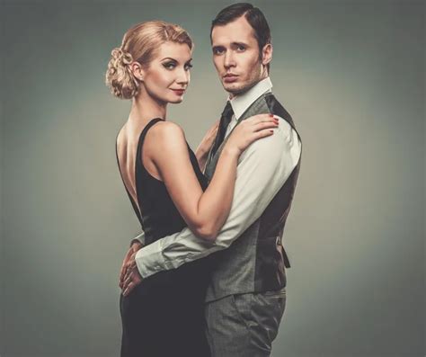 Well Dressed Retro Couple On Grey Background Stock Photo By Nejron