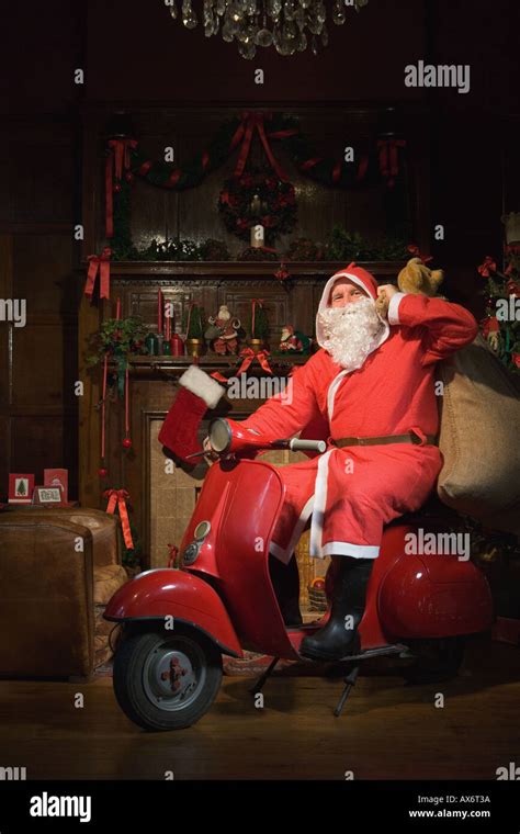 Santa Claus Riding A Moped Stock Photo Alamy