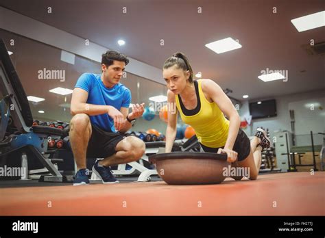 Fit Woman Working Out With Trainer Stock Photo Alamy
